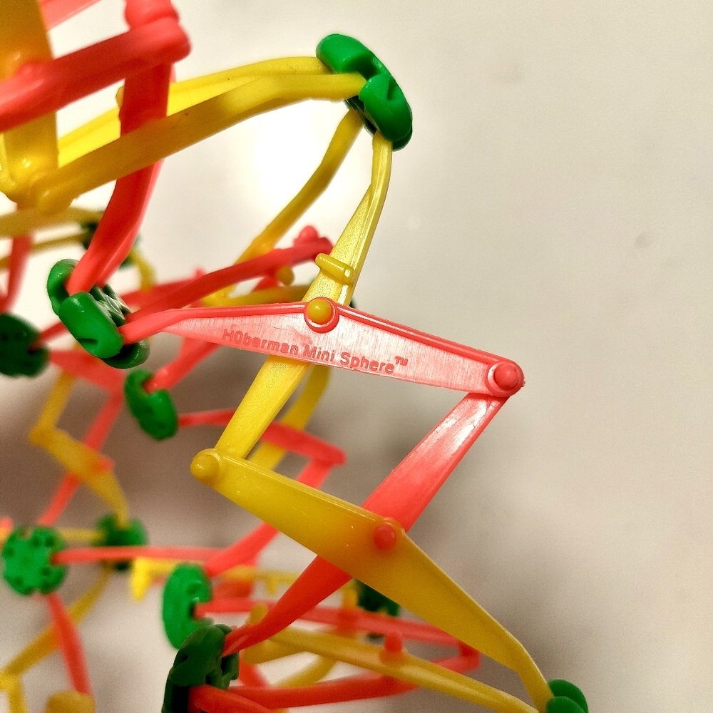 Hoberman Mini Sphere Expanding Breathing Ball Fidget Toy, Neon Pink Yellow Green - Picture 9 of 9